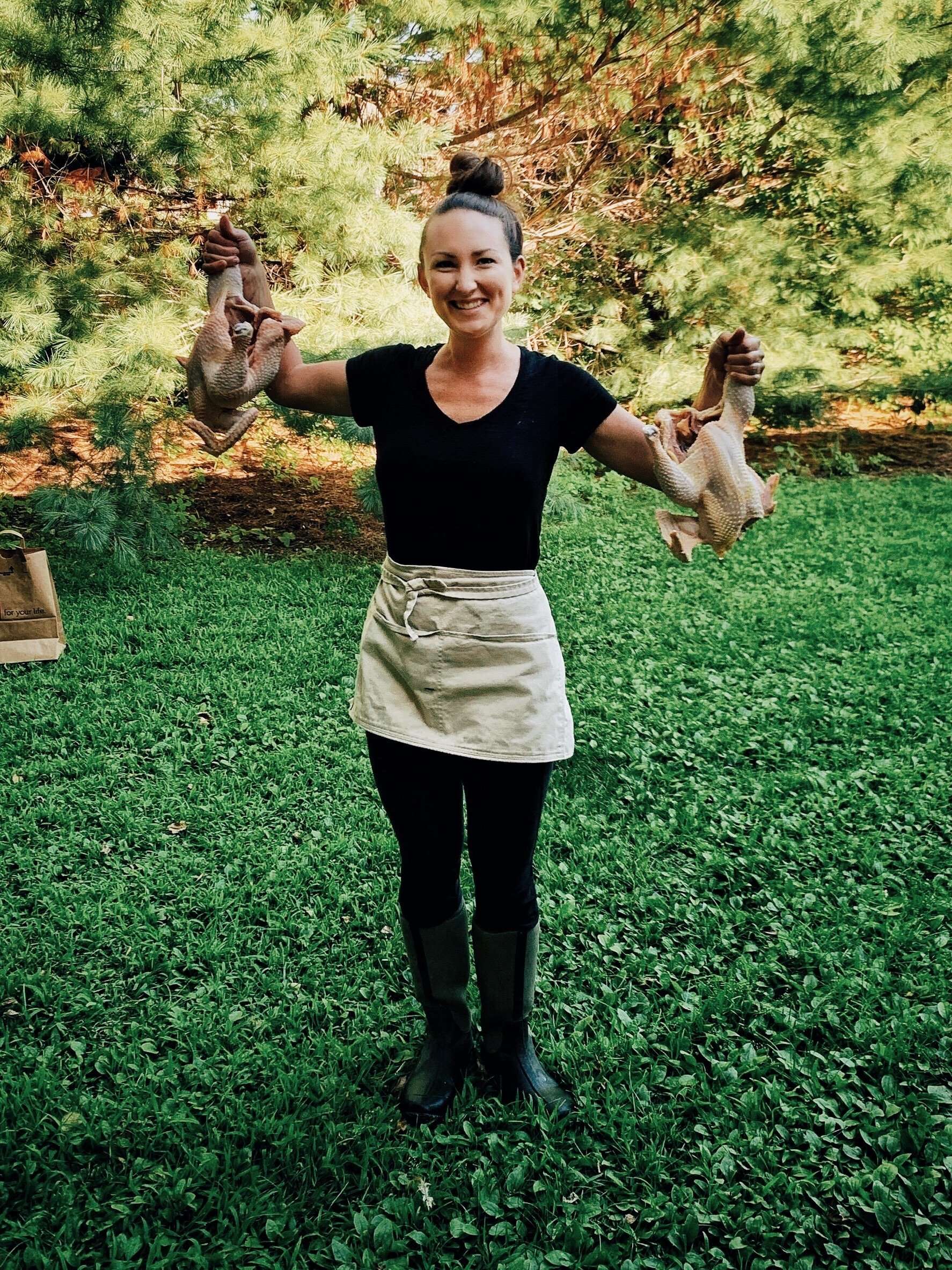 Katie holding butchered chickens