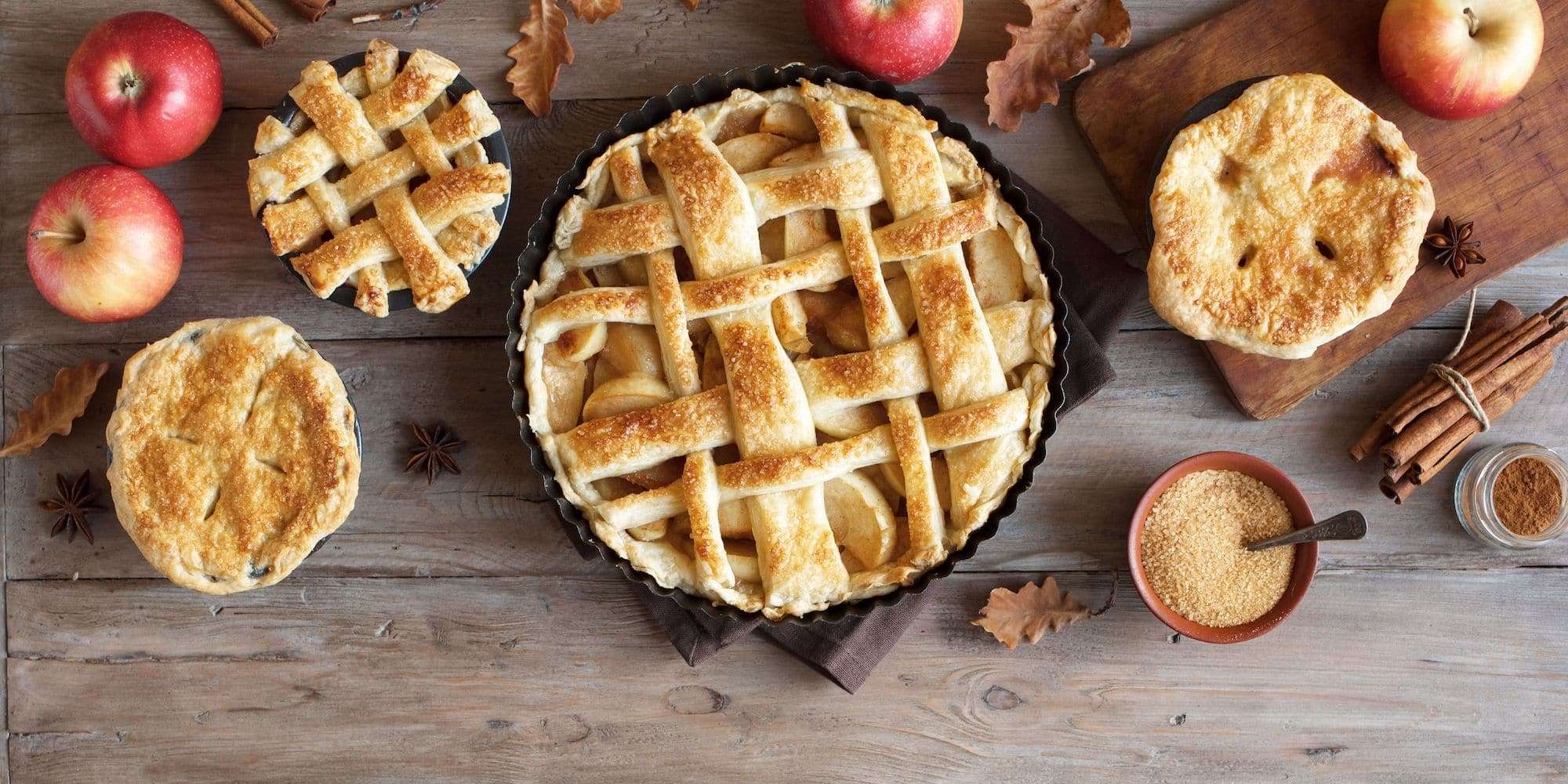 Pies and baked goods spread out on a table