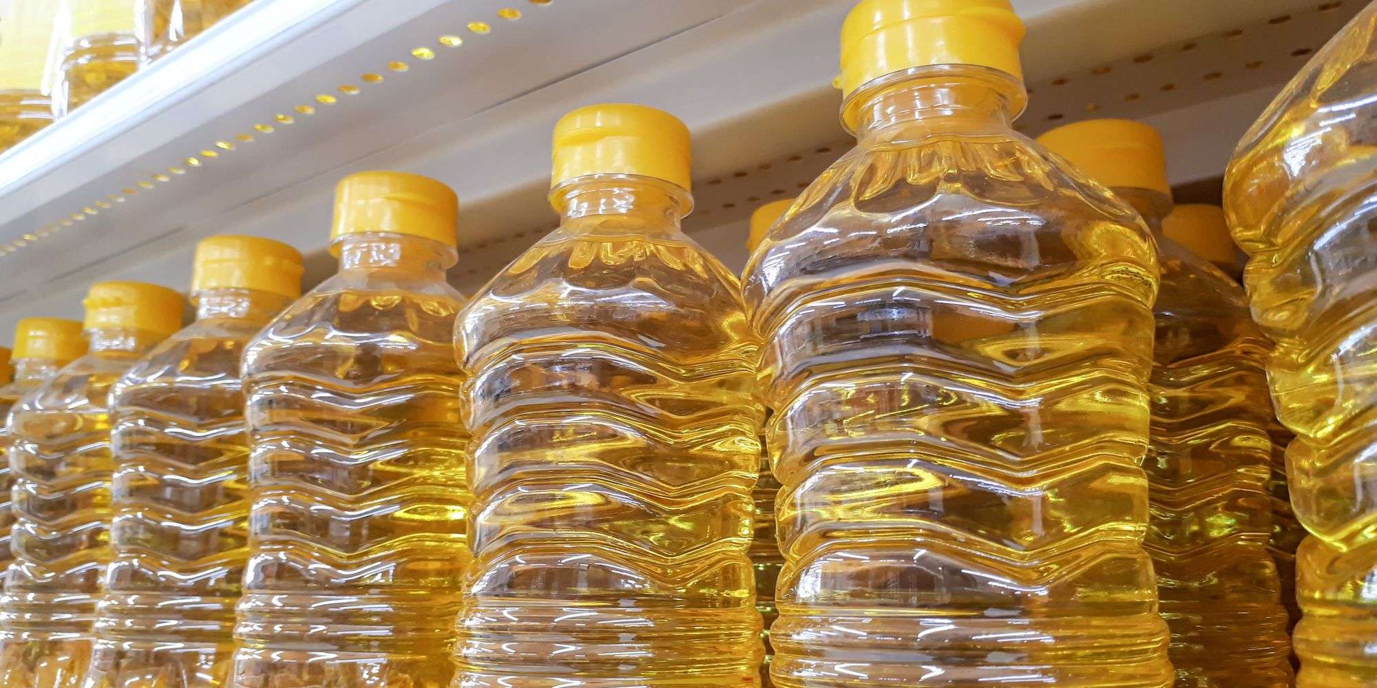 Bottles of vegetable oil on a shelf