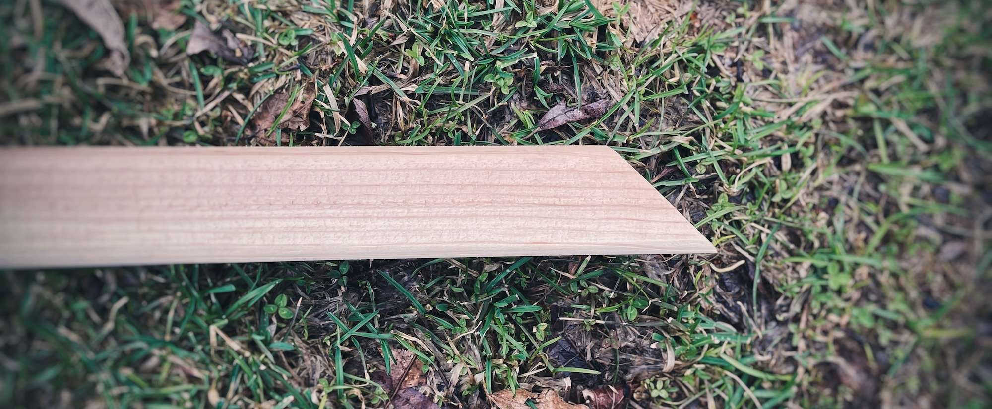 A cedar stake cut at a 45 degree angle