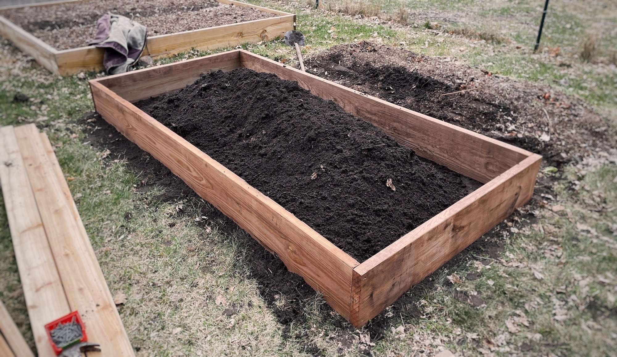 Constructing the raised bed. The sides are together and free standing now