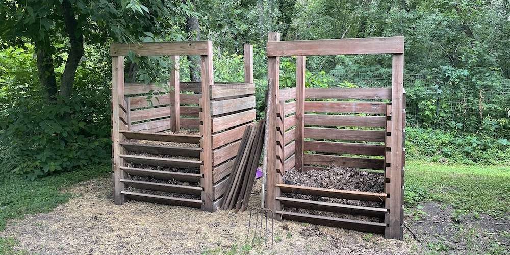 2 wooden compost bins side-by-side
