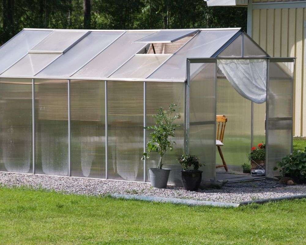 A greenhouse covered with polycarbonate plastic sheeting