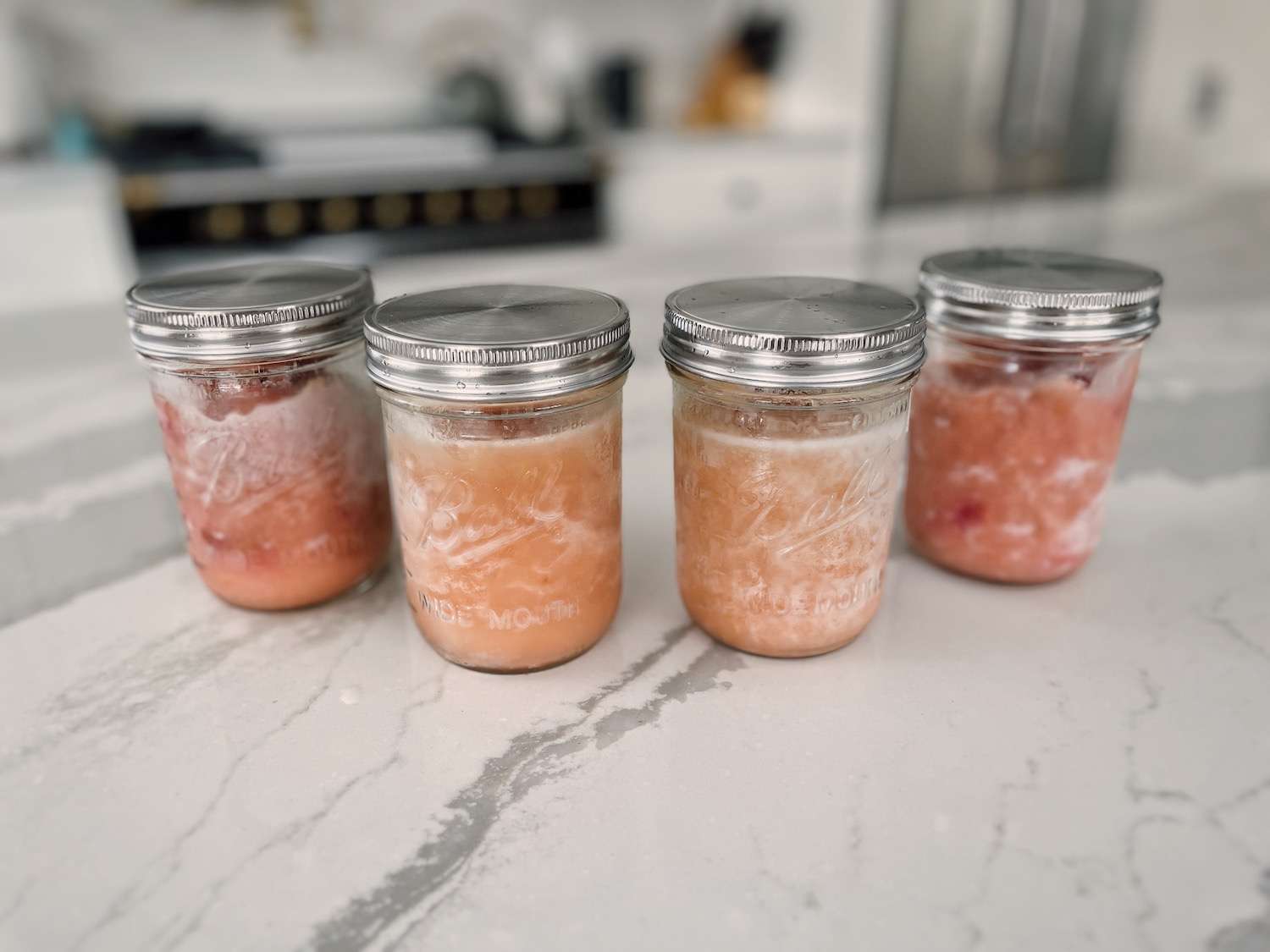 4 mason jars of applesauce fresh out of the freezer