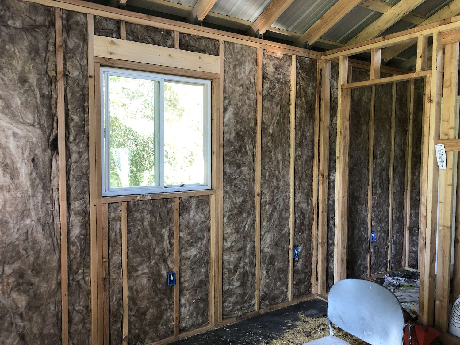 A photo inside our chicken coop - featuring insulation