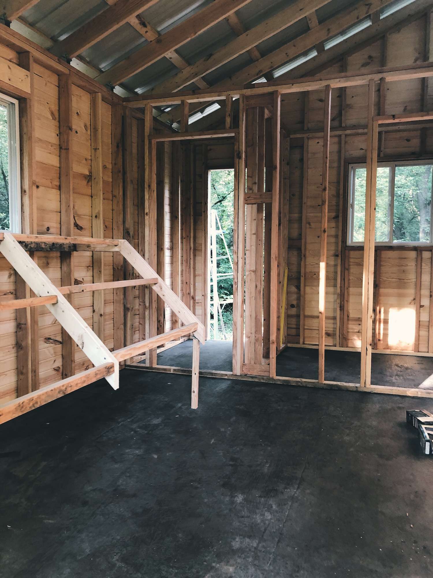 A photo of an empty chicken coop with linoleum flooring