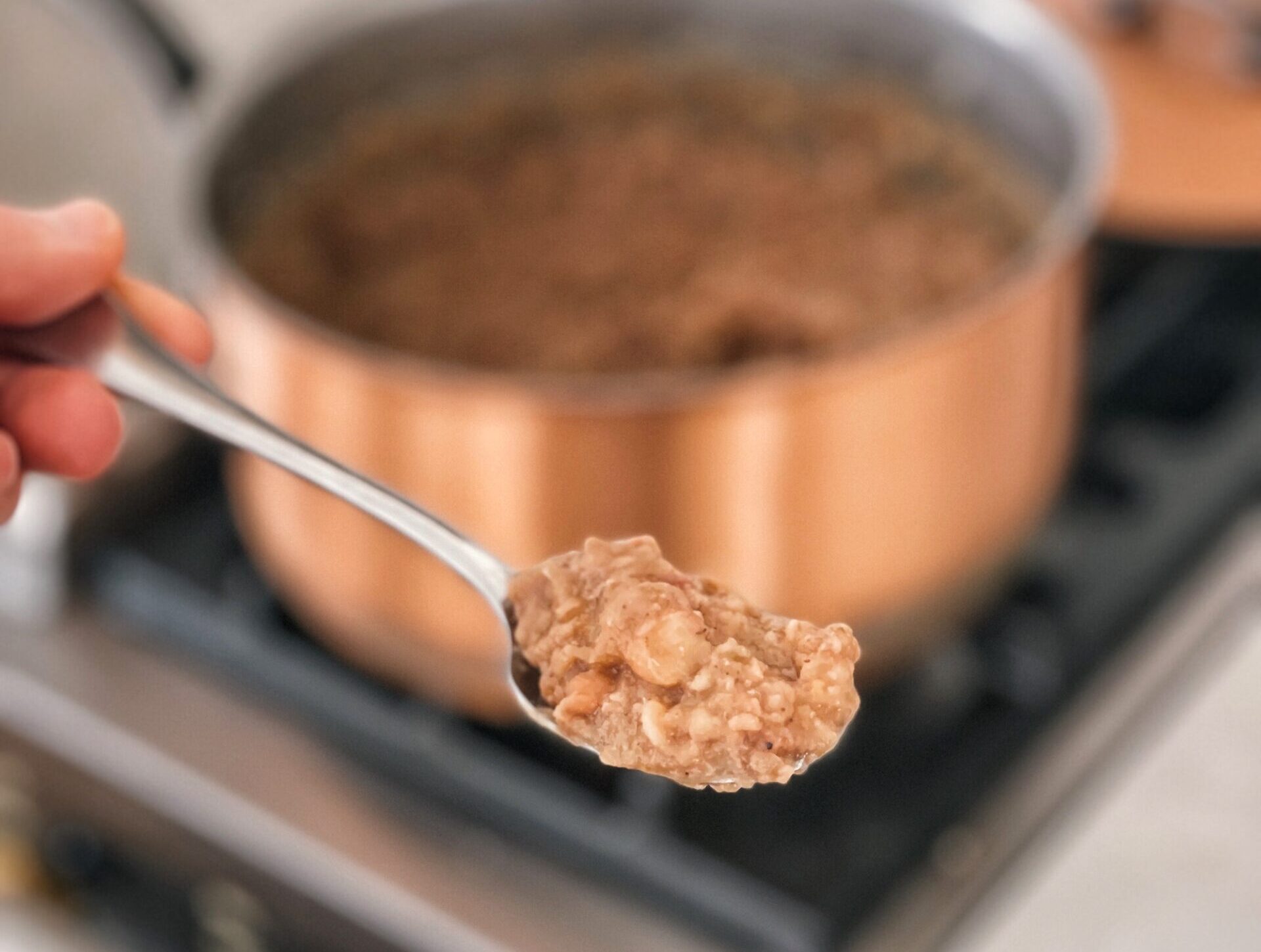 Close up of homestead refried beans on a spoon